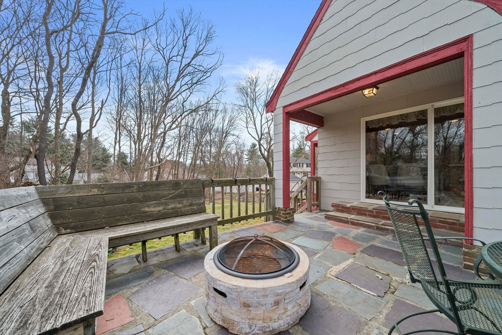 a house view with a sitting space and garden space