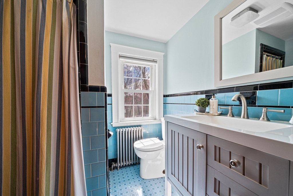 236 High Street Canton, MA 02021 - Photo 17 of 25 a bathroom with a sink a toilet and a mirror