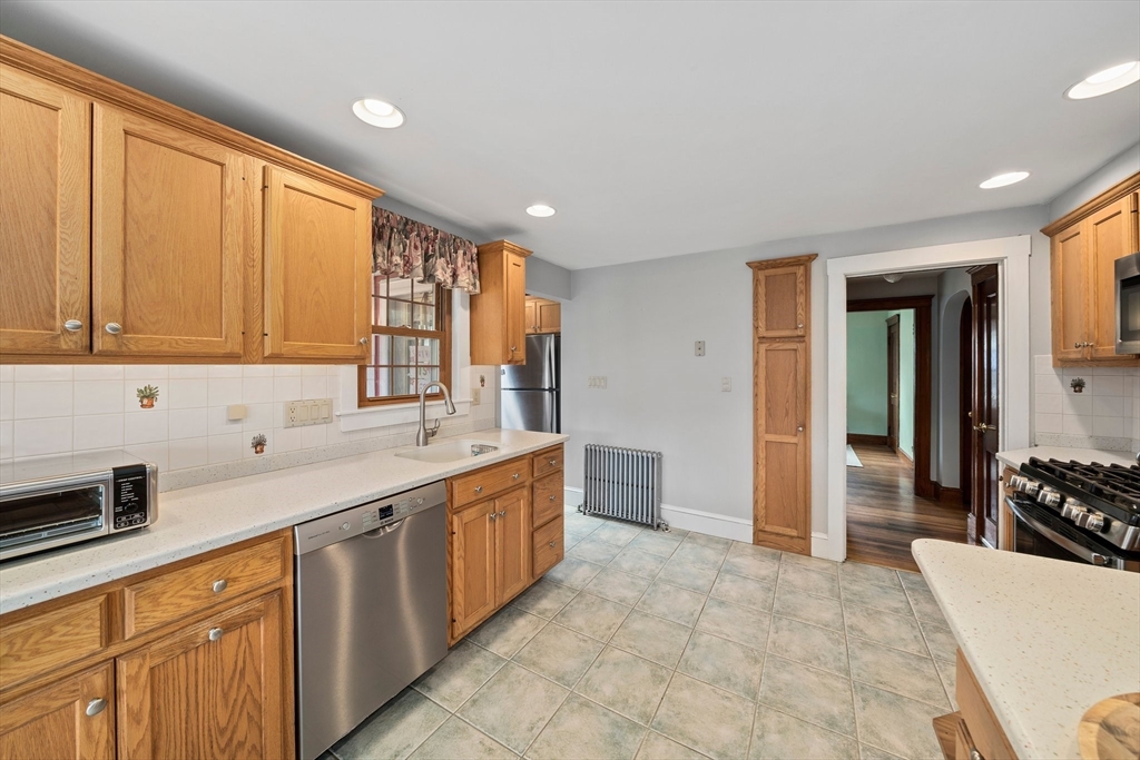 236 High Street Canton, MA 02021 - Photo 7 of 25 a large kitchen with kitchen island granite countertop a sink and cabinets