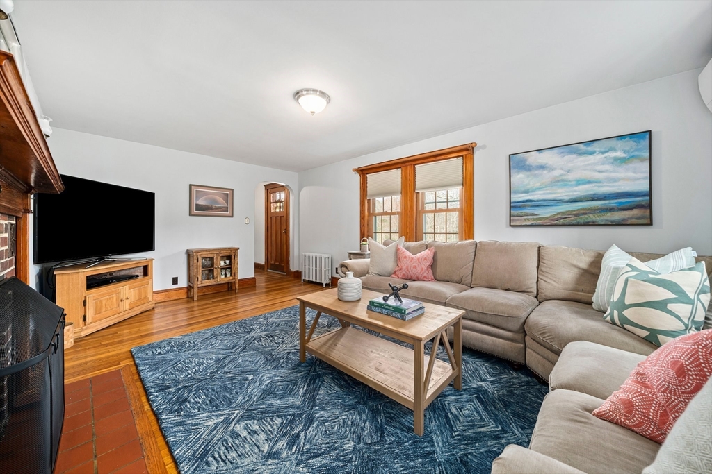 236 High Street Canton, MA 02021 - Photo 9 of 25 a living room with furniture and a flat screen tv