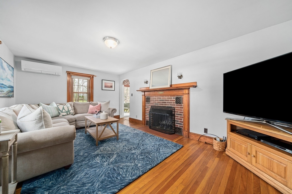 236 High Street Canton, MA 02021 - Photo 10 of 25 a living room with furniture and a flat screen tv