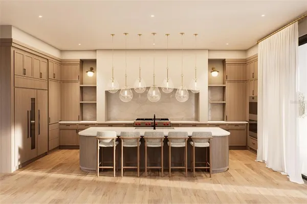 a large kitchen with a table and chairs