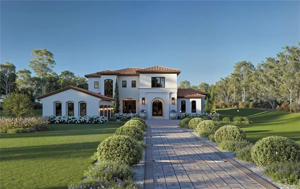 a front view of a house with a garden