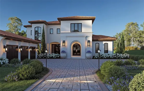 a front view of a house with yard and outdoor seating
