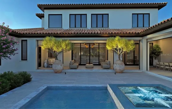 a view of a house with entryway and wooden floor