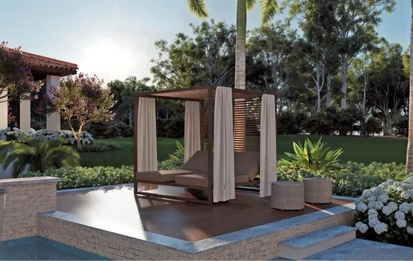 a view of a house with backyard and sitting area