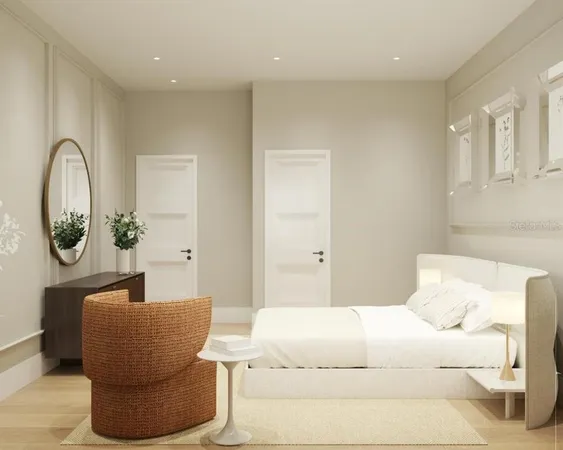 a bedroom with a bed a potted plant and a sink