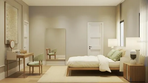 a bedroom with a bed and a chair