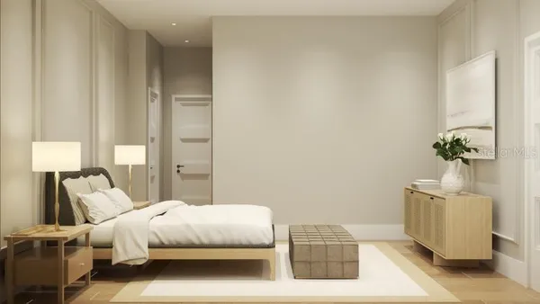 a bedroom with a bed and a potted plant