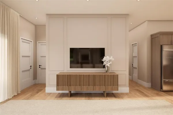 a living room with a couch and a flat screen tv