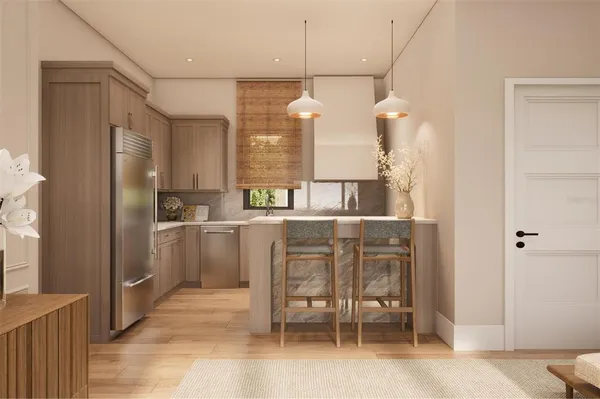 a kitchen with cabinets and stainless steel appliances