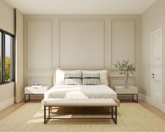 a spacious bedroom with a bed and a couch