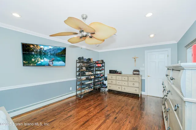 a bed room with furniture and a flat screen tv