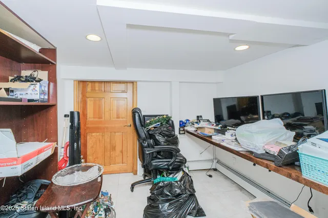 a room with furniture and a flat screen tv