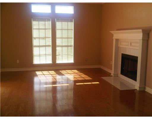 5102 Kings Court Corpus Christi, TX 78413 - Photo 2 of 5 a view of an empty room with window and fireplace