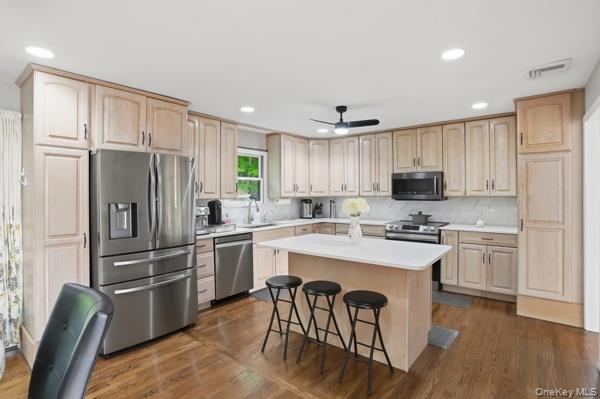 31 Laura Road Monroe, NY 10950 - Photo 10 of 39 a kitchen with white cabinets stainless steel appliances and a refrigerator