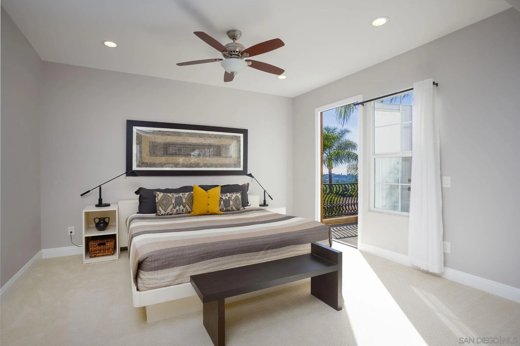 845 Vista Point Circle Vista, CA 92084 - Photo 22 of 58 a bedroom with a bed and a painting on the wall