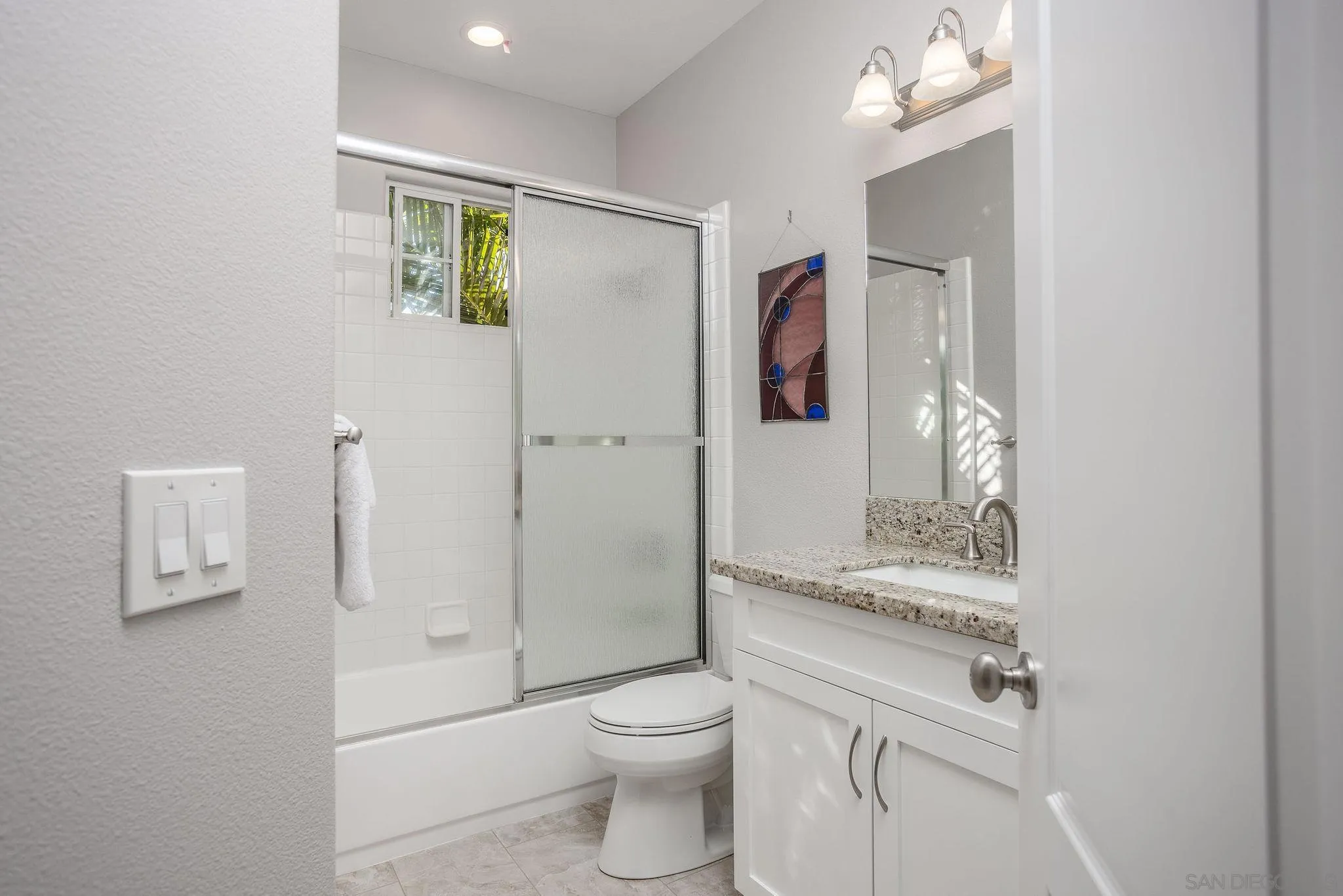 845 Vista Point Circle Vista, CA 92084 - Photo 34 of 58 a bathroom with a granite countertop sink toilet and shower