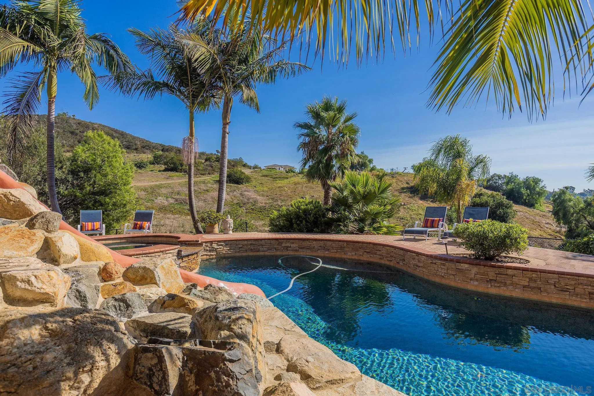 845 Vista Point Circle Vista, CA 92084 - Photo 40 of 58 a view of swimming pool with a table and chairs