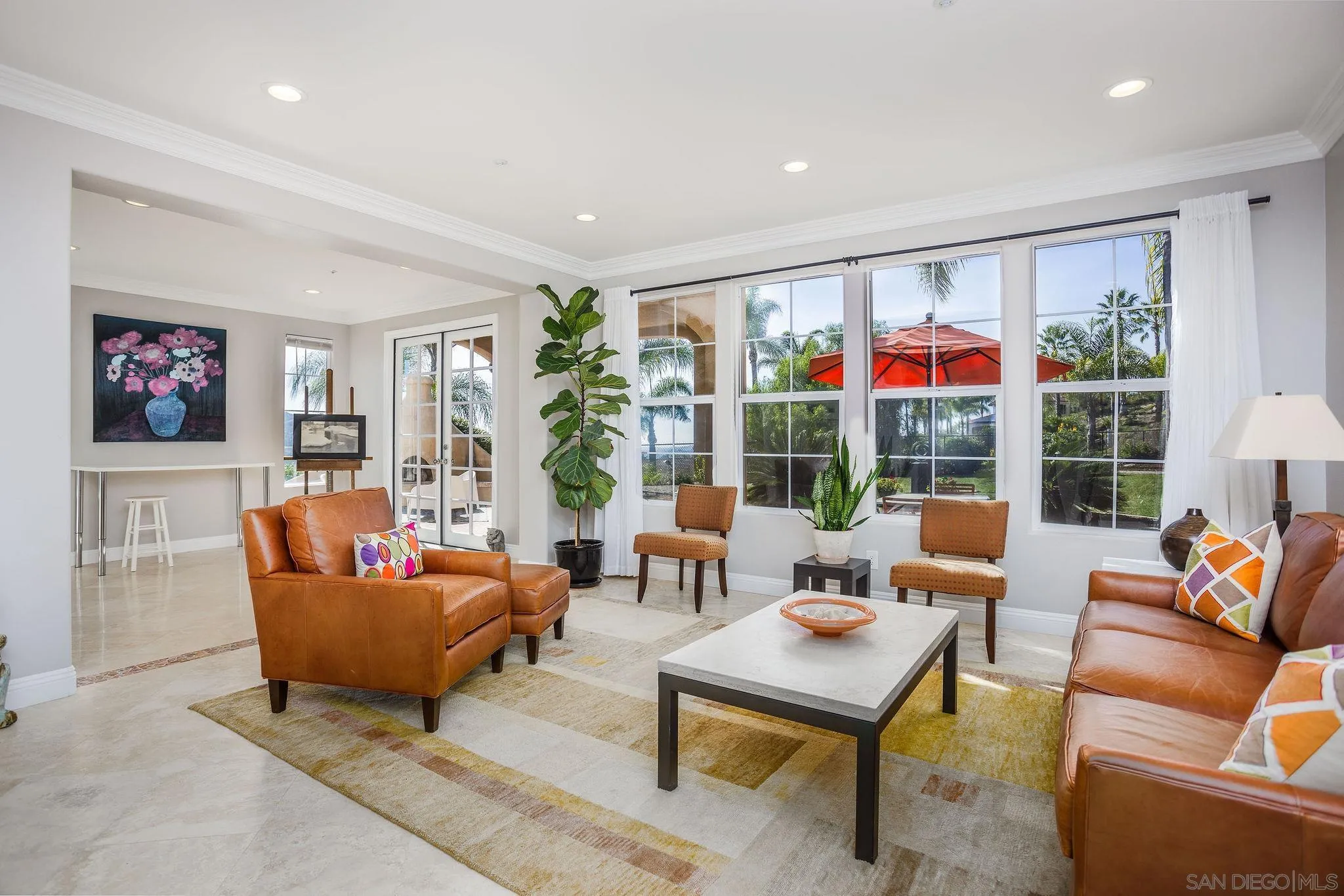845 Vista Point Circle Vista, CA 92084 - Photo 7 of 58 a living room with patio furniture and a potted plant