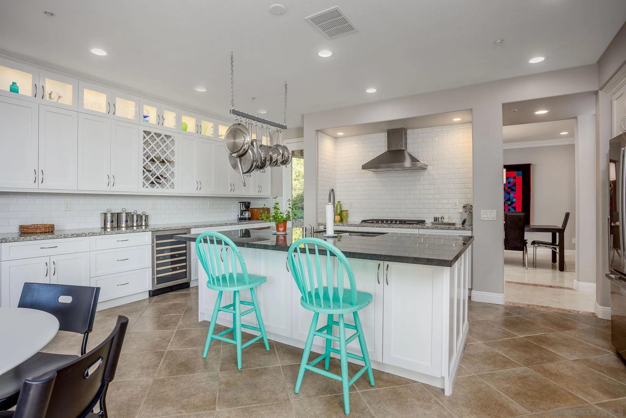 845 Vista Point Circle Vista, CA 92084 - Photo 10 of 58 a kitchen with a table and chairs in it