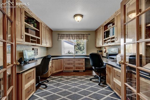 8460 Tibbs Road Peyton, CO 80831 - Photo 18 of 37 2 Person Office with Custom Built-in Cabinetry throughout