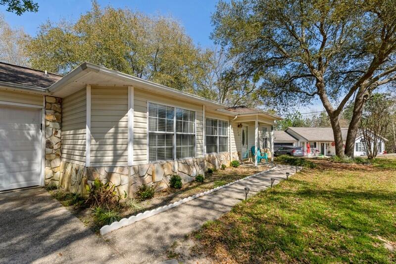 138 Edna Drive Crestview, FL 32536 - Photo 1 of 26 a front view of a house with a yard