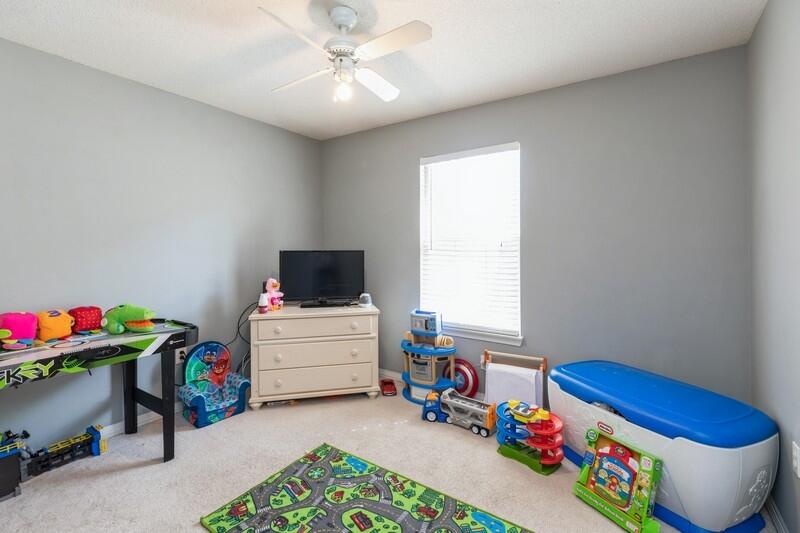 138 Edna Drive Crestview, FL 32536 - Photo 14 of 26 a room with toys and a baby crib