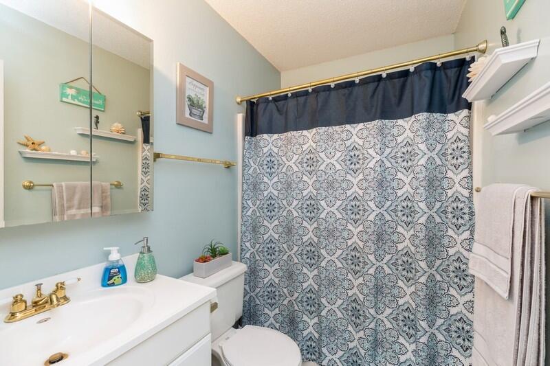 138 Edna Drive Crestview, FL 32536 - Photo 16 of 26 a bathroom with a shower curtain and a sink