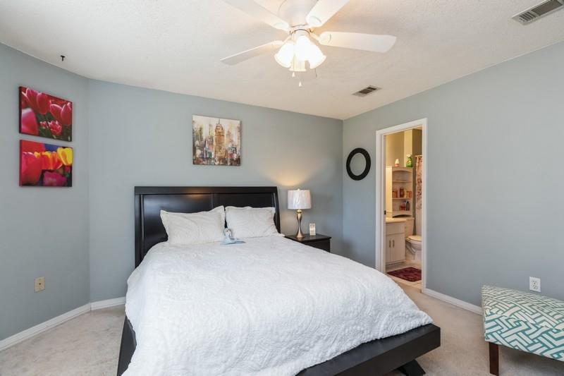 138 Edna Drive Crestview, FL 32536 - Photo 17 of 26 a bedroom with a bed and a chandelier