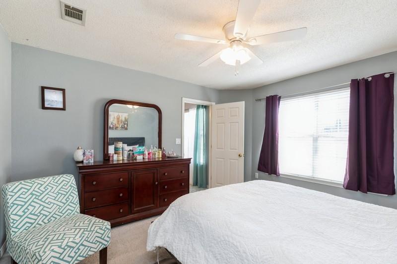 138 Edna Drive Crestview, FL 32536 - Photo 18 of 26 a bedroom with a bed and a dresser