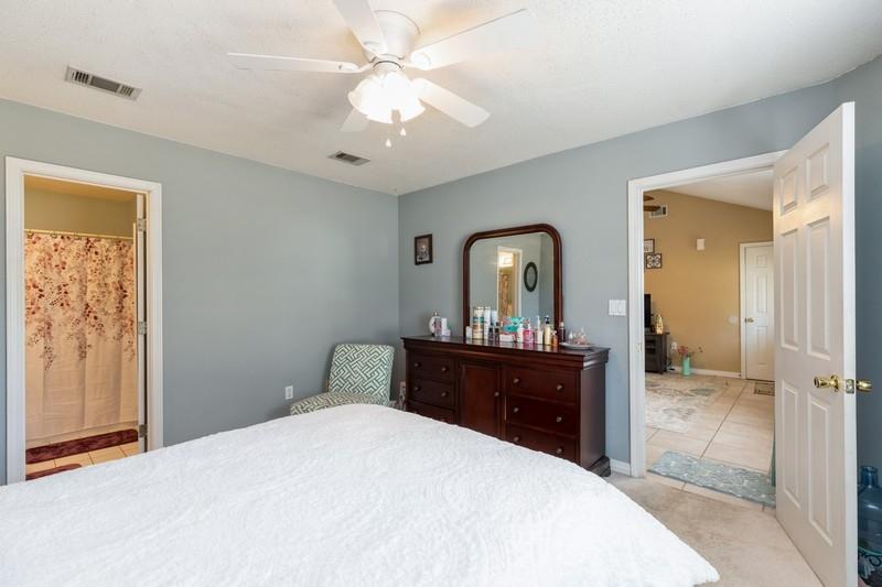 138 Edna Drive Crestview, FL 32536 - Photo 19 of 26 a bedroom with a bed and a dresser