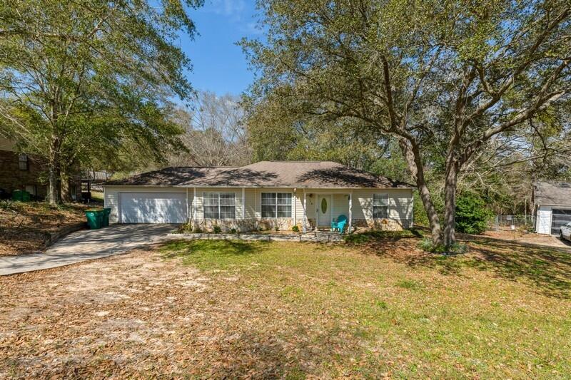 138 Edna Drive Crestview, FL 32536 - Photo 2 of 26 a view of a house with a yard