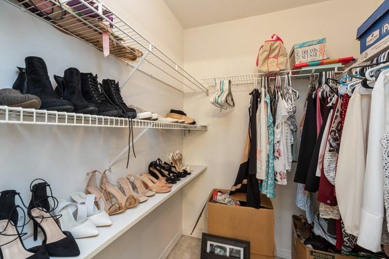 138 Edna Drive Crestview, FL 32536 - Photo 22 of 26 a view of walk in closet with clothes and shoes