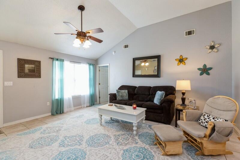 138 Edna Drive Crestview, FL 32536 - Photo 4 of 26 a living room with furniture and wooden floor