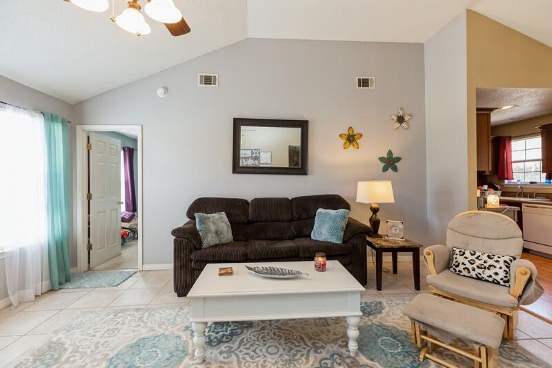 138 Edna Drive Crestview, FL 32536 - Photo 5 of 26 a living room with furniture and a rug