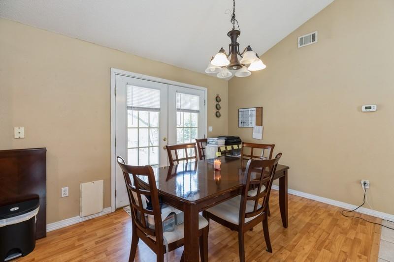 138 Edna Drive Crestview, FL 32536 - Photo 8 of 26 a view of a dining room with furniture window and wooden floor
