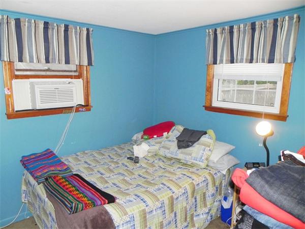 24 Wixon Road Dennis, MA 02639 - Photo 12 of 12 a bedroom with a bed and a window
