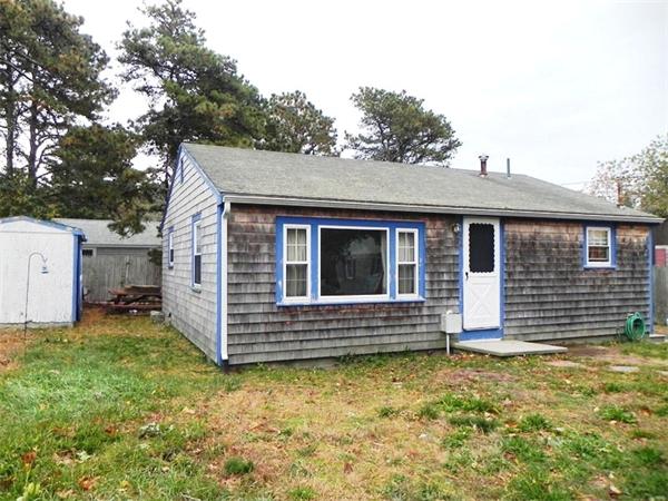24 Wixon Road Dennis, MA 02639 - Photo 2 of 12 a view of house with backyard