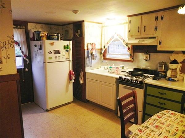 24 Wixon Road Dennis, MA 02639 - Photo 3 of 12 a kitchen with refrigerator and stove