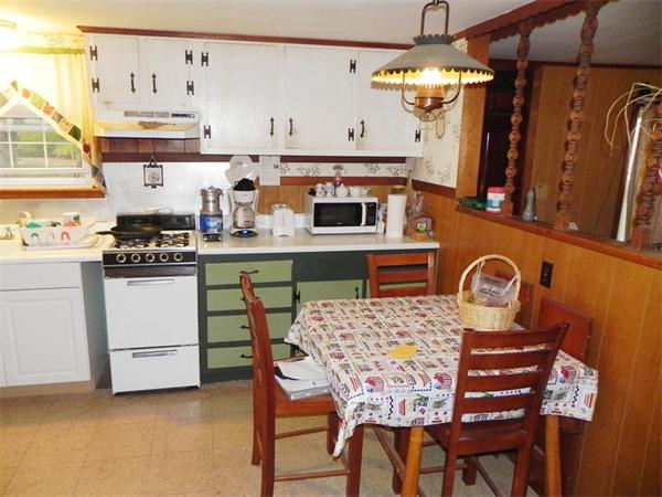 24 Wixon Road Dennis, MA 02639 - Photo 5 of 12 a kitchen with stainless steel appliances granite countertop a stove a sink and a refrigerator