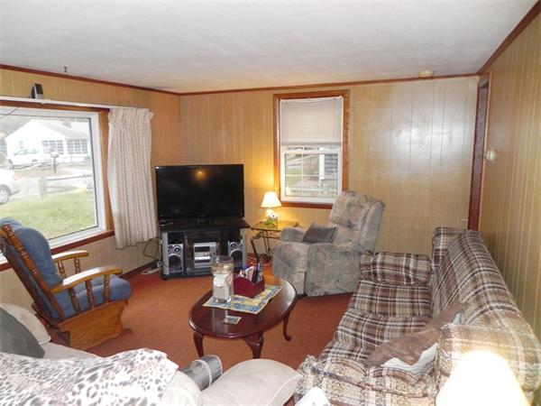 24 Wixon Road Dennis, MA 02639 - Photo 6 of 12 a living room with furniture and a flat screen tv