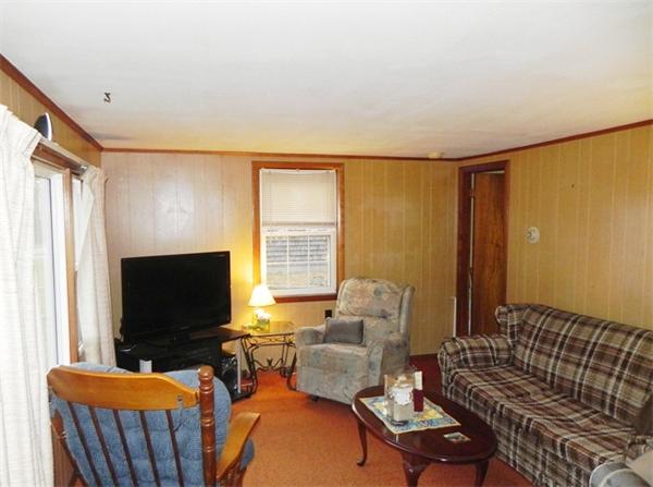 24 Wixon Road Dennis, MA 02639 - Photo 7 of 12 a living room with furniture and a flat screen tv