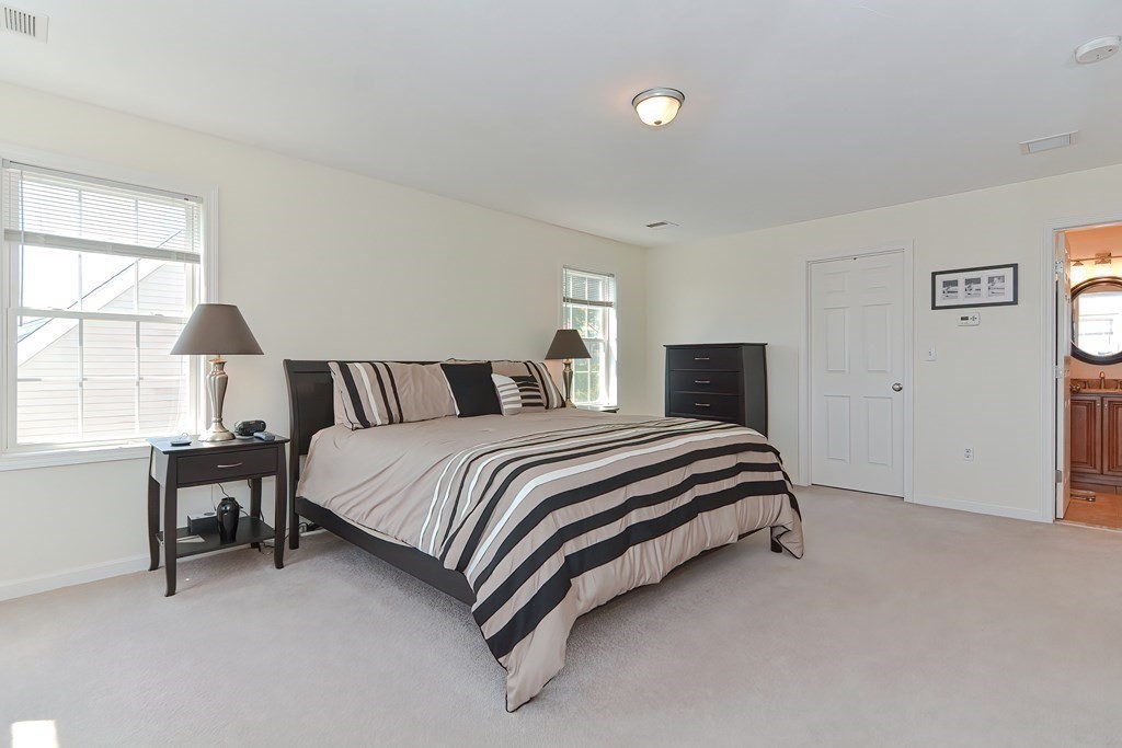 82 Swift Road Framingham, MA 01702 - Photo 23 of 39 a bedroom with a bed and chair