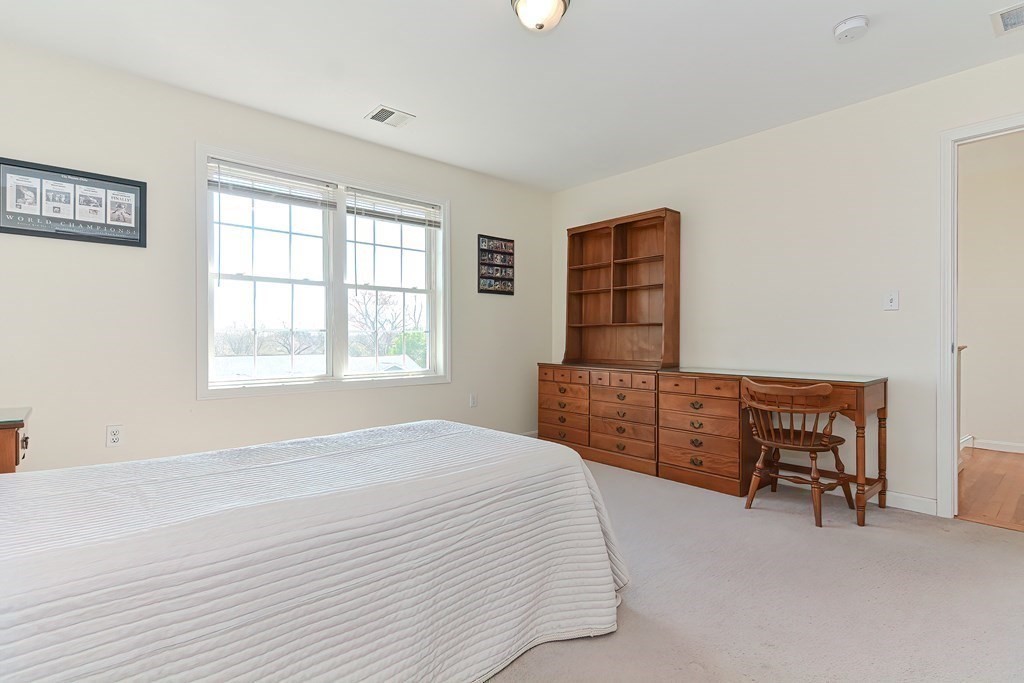 82 Swift Road Framingham, MA 01702 - Photo 32 of 39 a bedroom with a bed and furniture