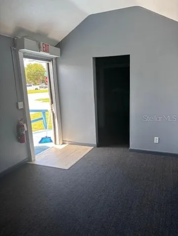 a view of an empty room with a window