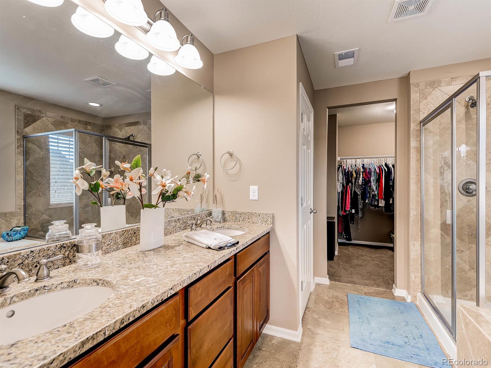 714 Springvale Road Castle Rock, CO 80104 - Photo 17 of 28 a bathroom with a sink and a mirror