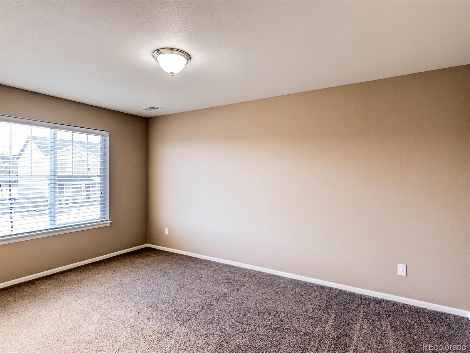 714 Springvale Road Castle Rock, CO 80104 - Photo 18 of 28 an empty room with a window