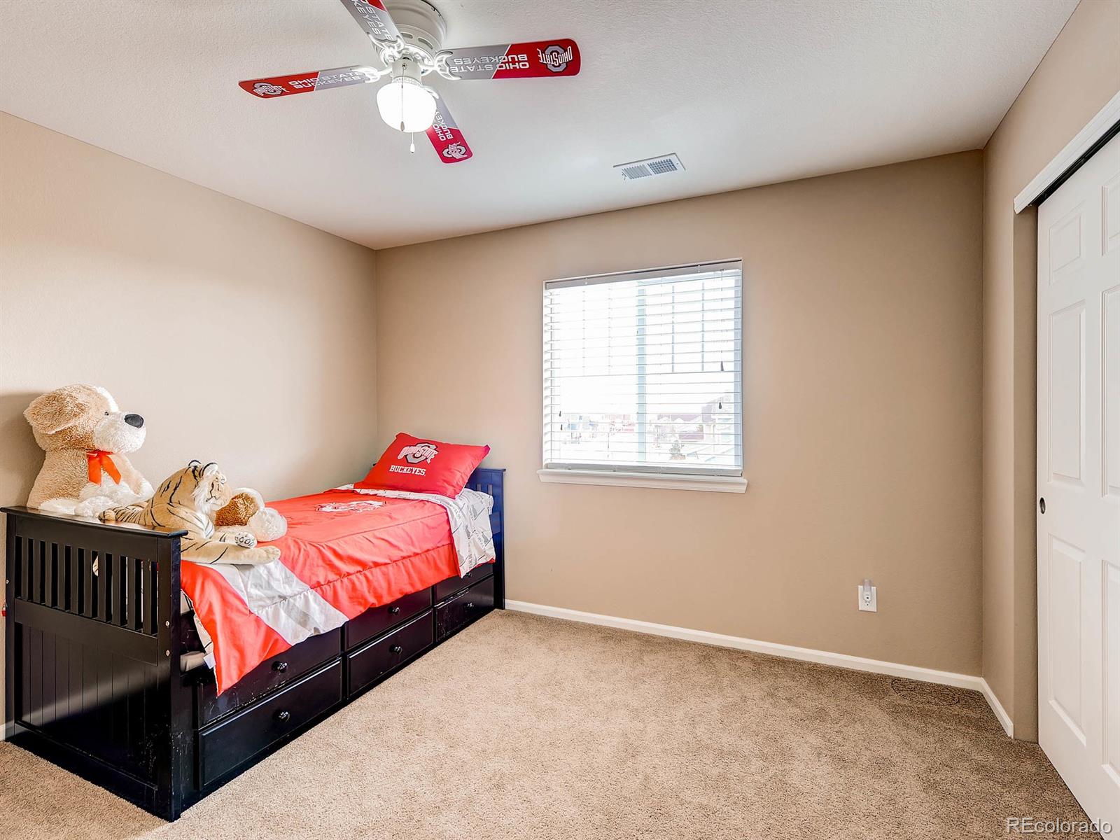714 Springvale Road Castle Rock, CO 80104 - Photo 19 of 28 a bedroom with a bed and window