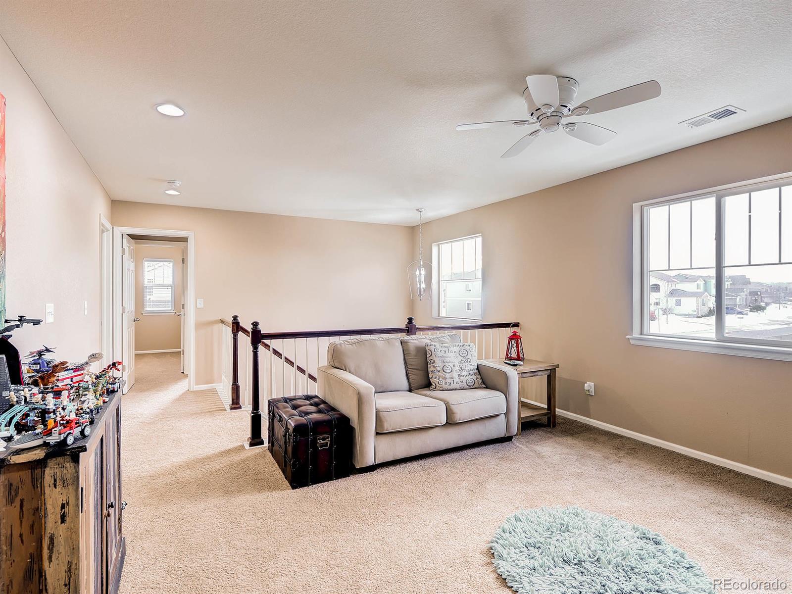 714 Springvale Road Castle Rock, CO 80104 - Photo 23 of 28 a living room with furniture and a window